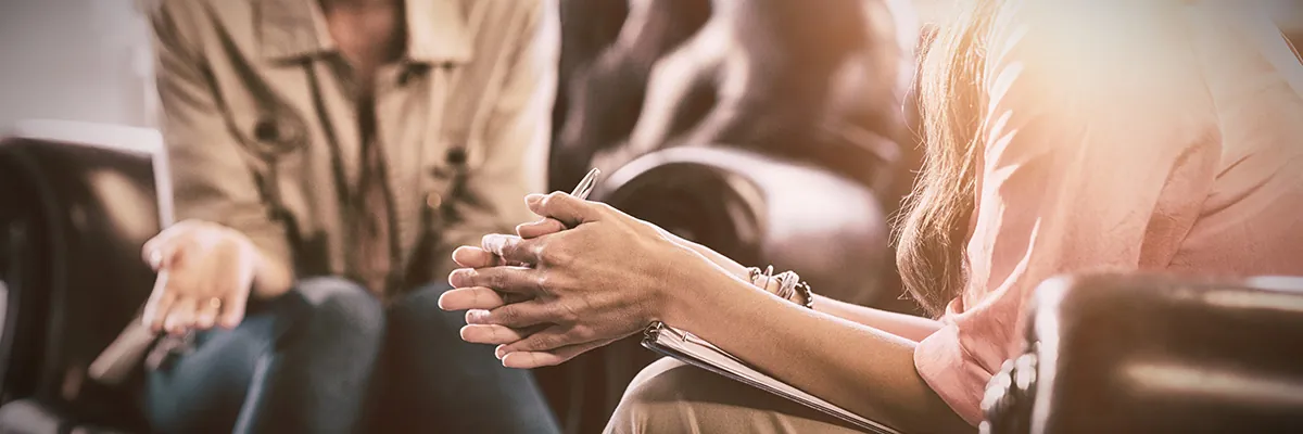 Two people talking in a therapy session
